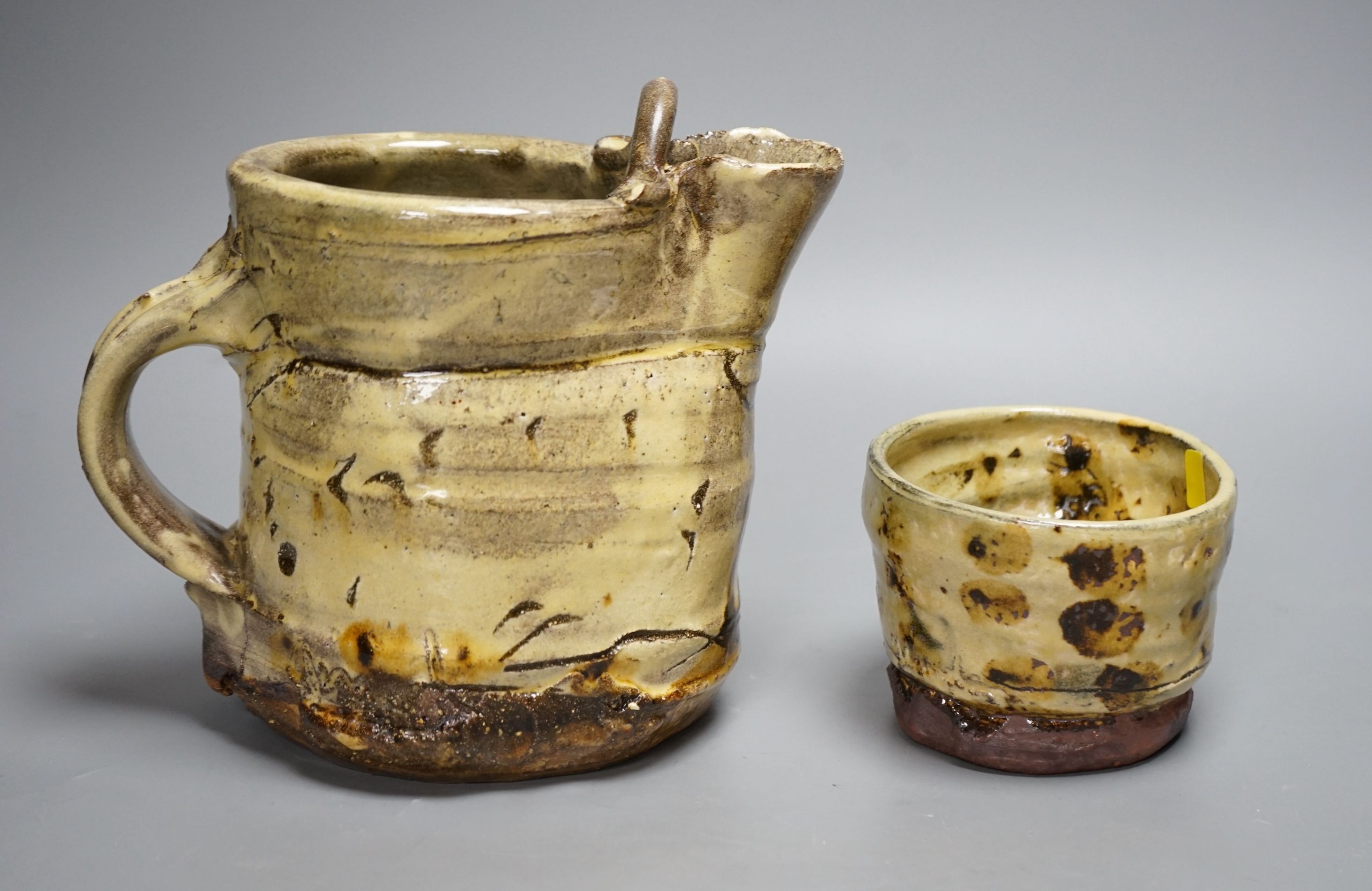Jean-Nicolas Gérard (b.1954), a pale yellow and brown glazed earthenware jug and a similar bowl, with purchase receipt from Goldmark Gallery dated 09/04/2014, tallest 19.5cm, (2)